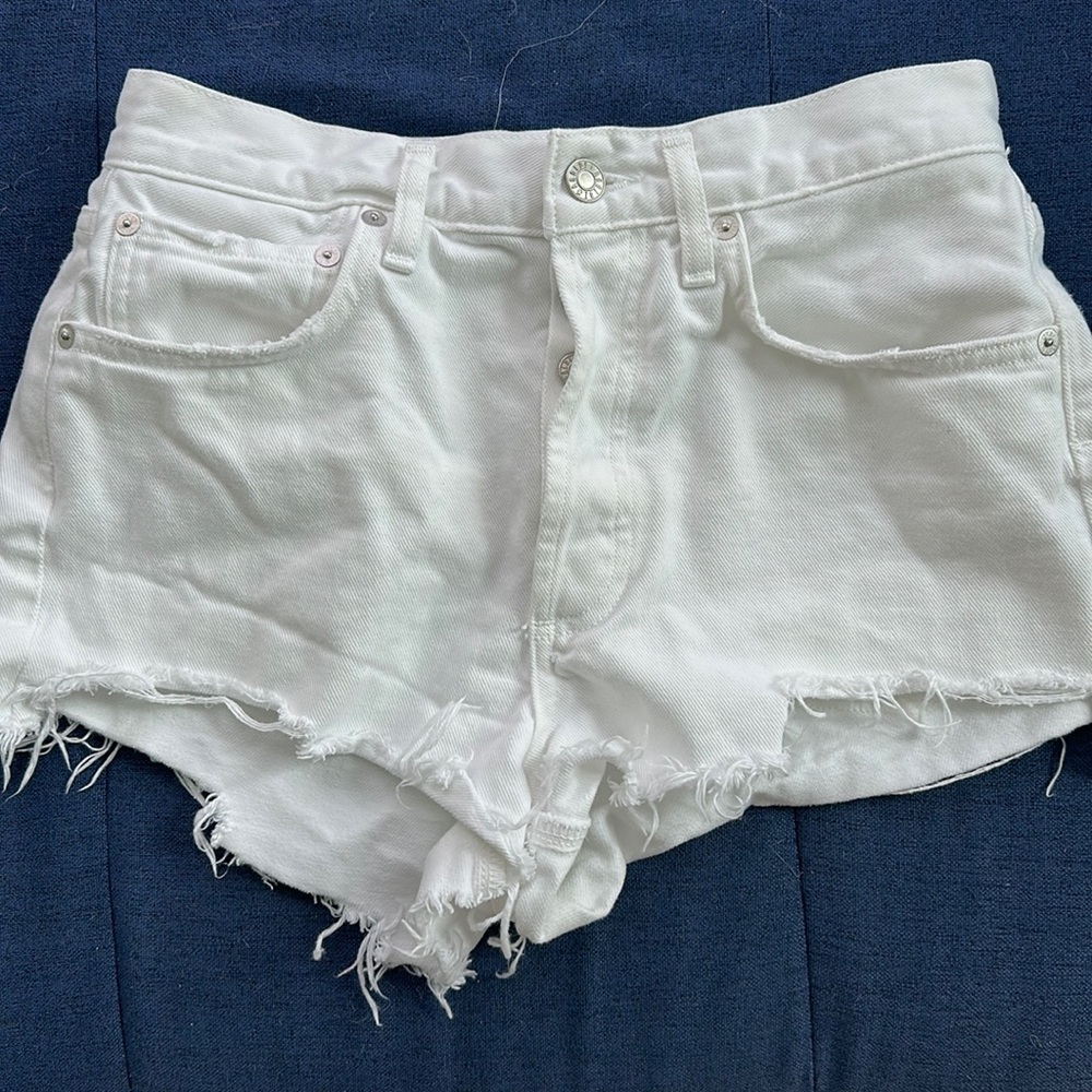AGOLDE white jean shorts distressed